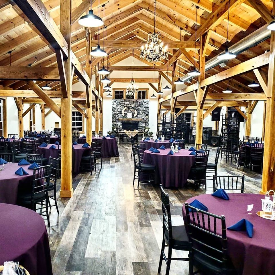 Wedding tables decorated with purple tablecloths - Fox Meadow Barn - Blue Ridge Timberwrights Event Venues Gallery