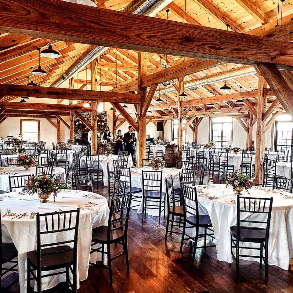 Wedding Party looking at decorated tables - Fox Meadow Barn - Blue Ridge Timberwrights Event Venues Gallery